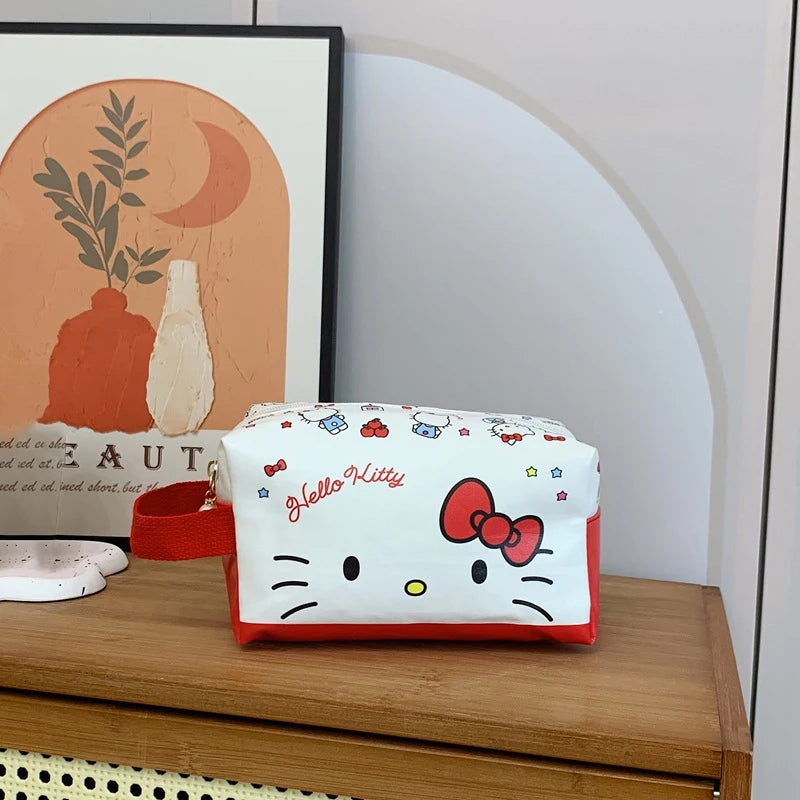 Hello Kitty pouch on a wooden surface with a framed picture in the background