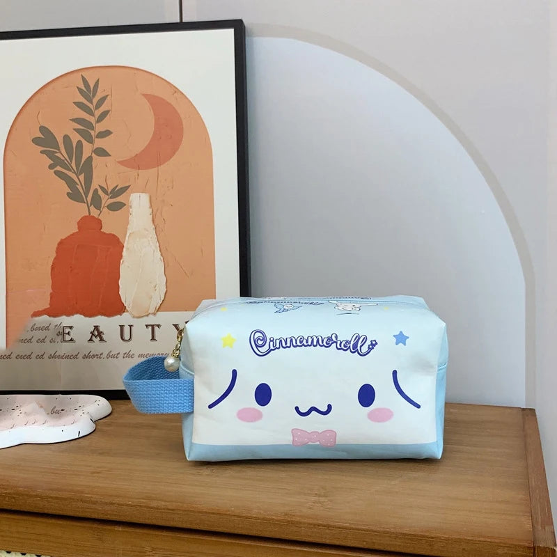 Cinnamoroll-themed pouch on a wooden surface with a framed picture in the background