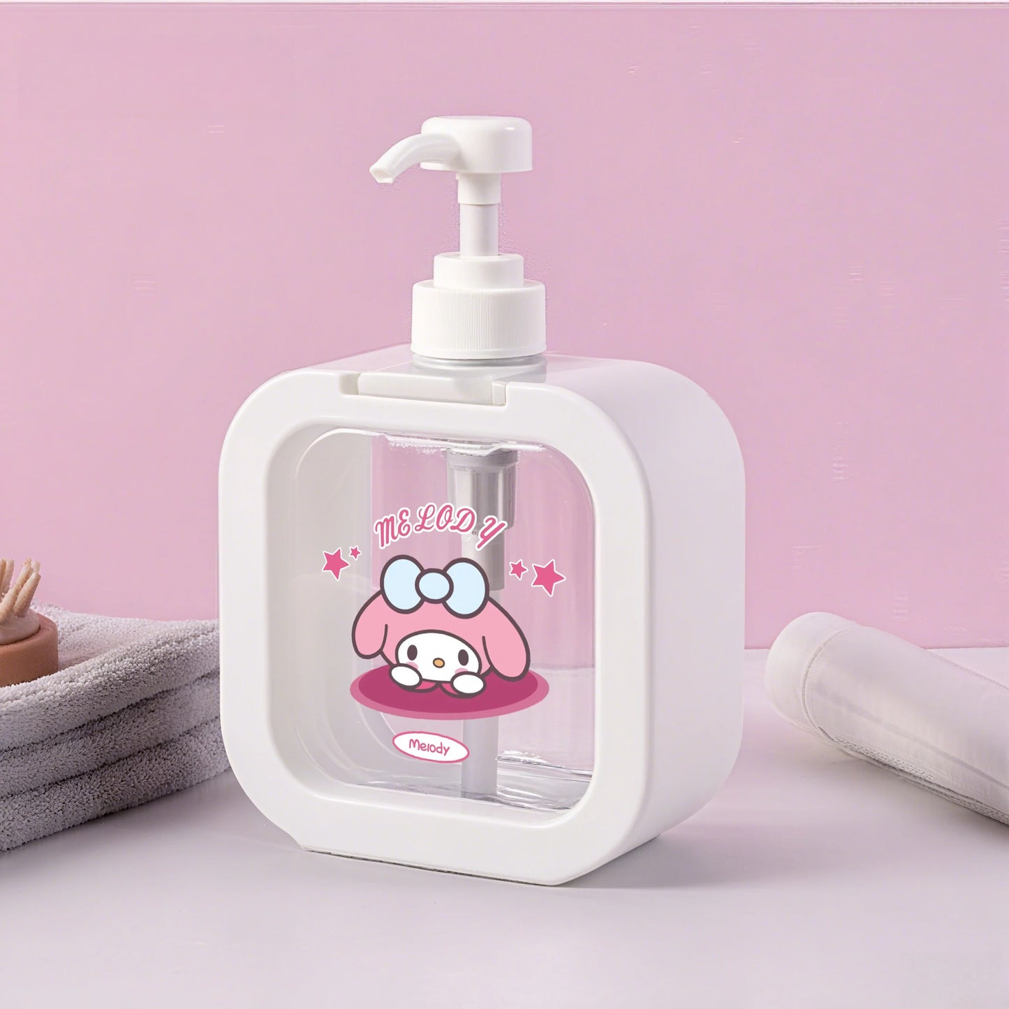 White soap dispenser with cartoon character on a pink background