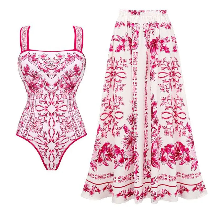 Floral swimsuit and skirt set with pink and red patterns on a white background