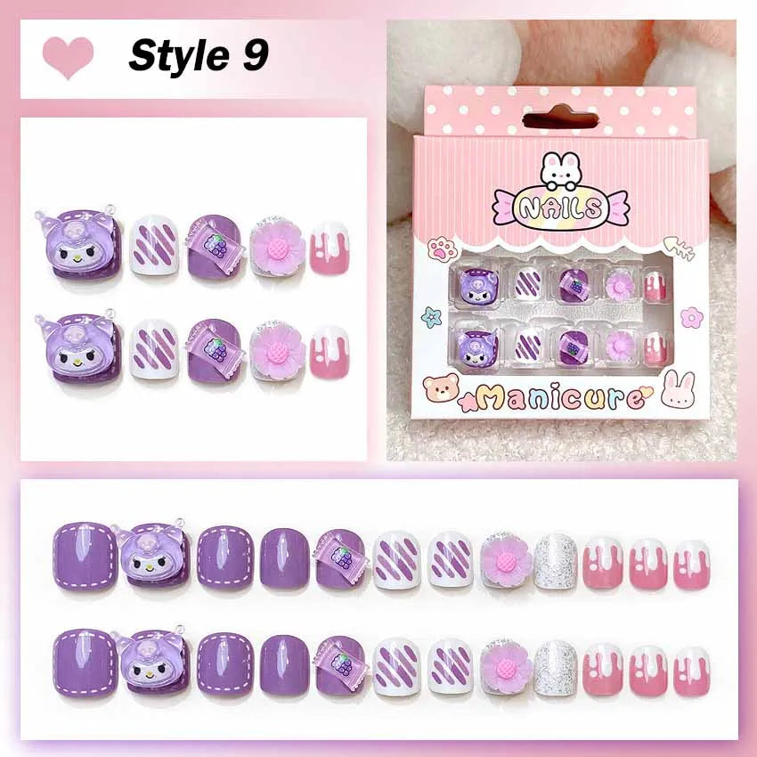 Set of cartoon-themed false nails with packaging on a pink background