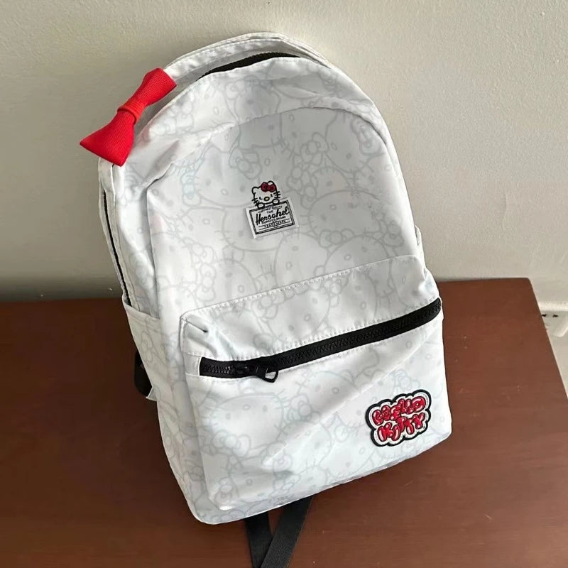 White backpack with red accents and branding on a wooden surface.