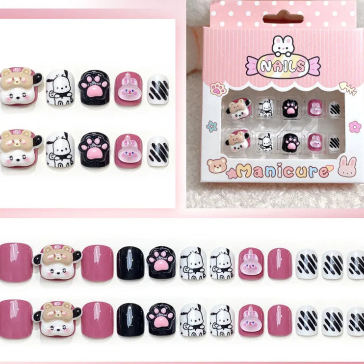 Set of cartoon-themed nail art designs with packaging on a pink background