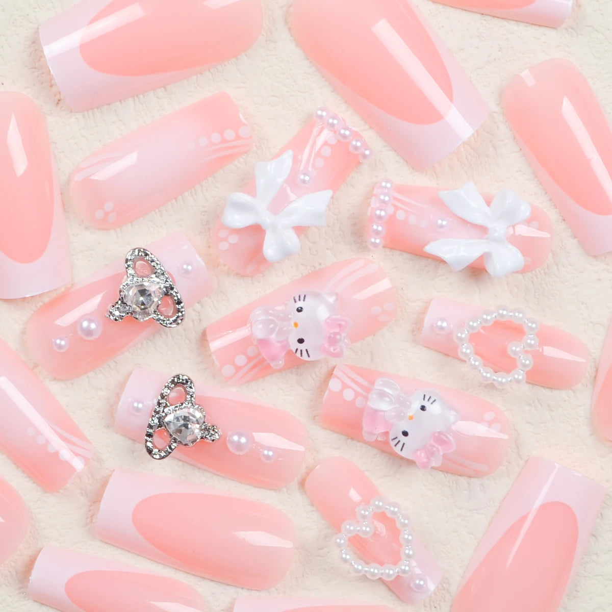 Pink nail art with decorative elements on a beige background