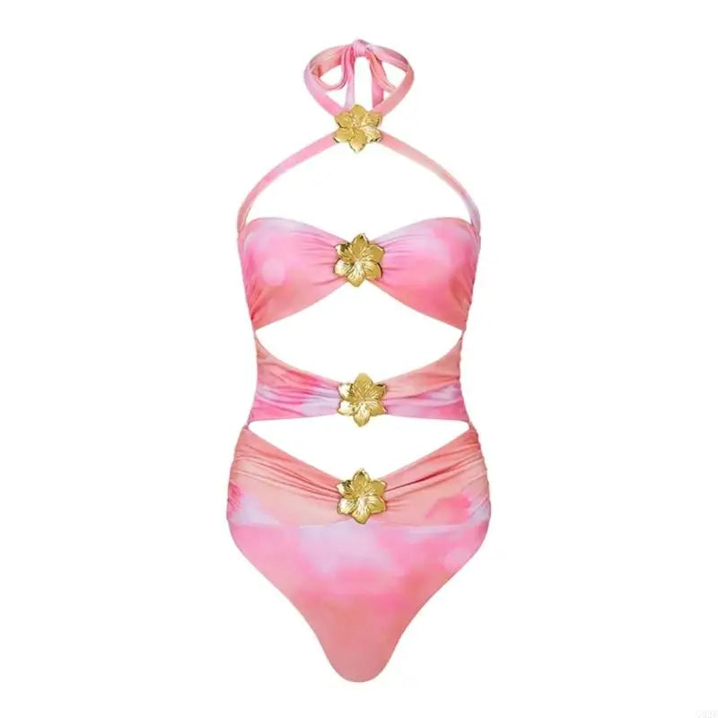Pink and white swimsuit with gold floral accents on a white background