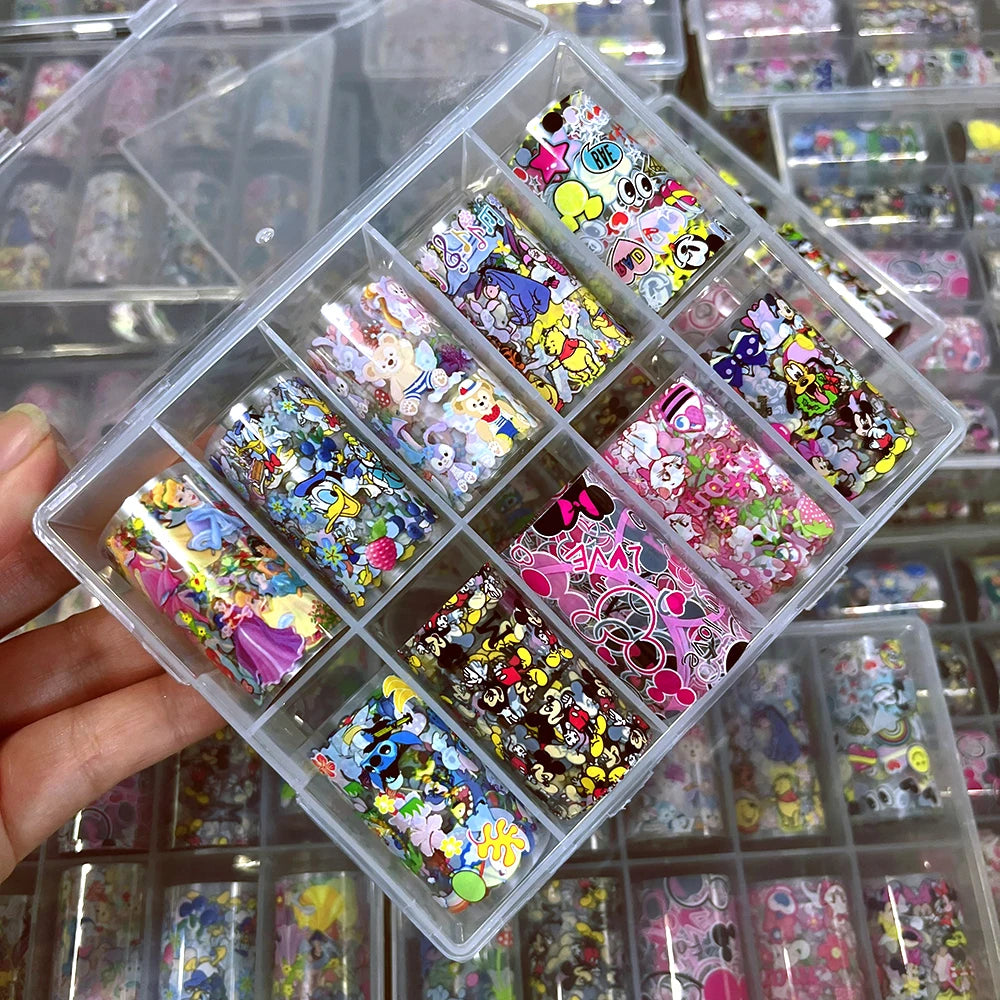 Clear plastic organizer with colorful nail art decorations held by a hand.