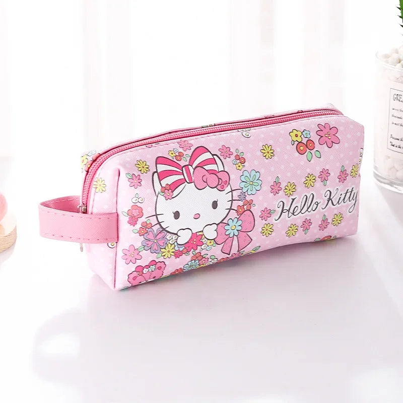 Pink pencil case with Hello Kitty design on a white background