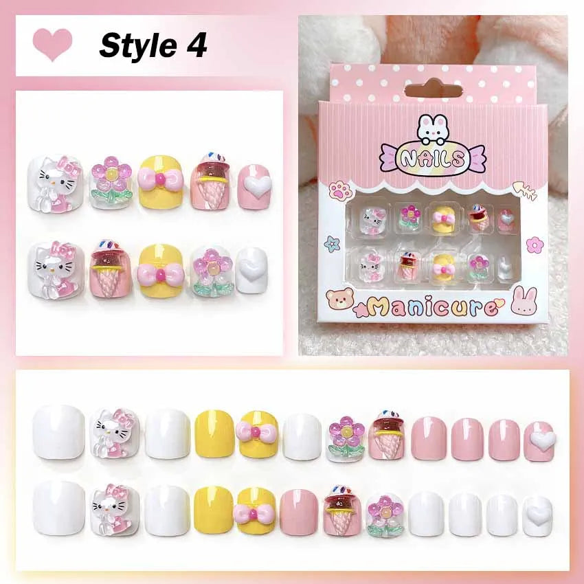 Set of cartoon-themed false nails with packaging on a pink background
