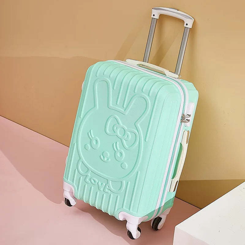 Mint green suitcase with a Hello Kitty design on a beige background