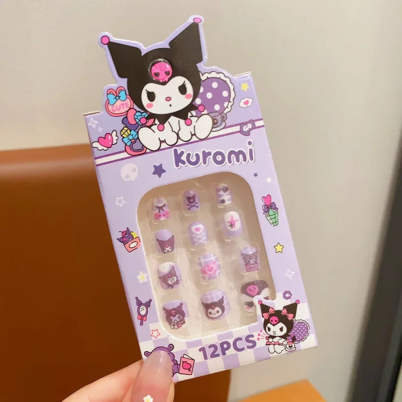 Packaged set of 12 cartoon character nail art decorations with 'kuromi' branding.