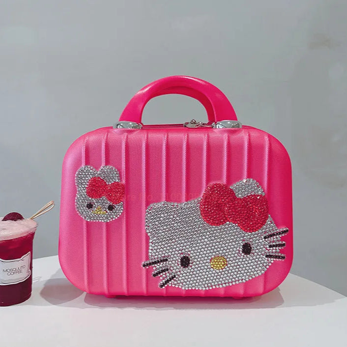 Pink makeup case with Hello Kitty design on a white surface with a gray background