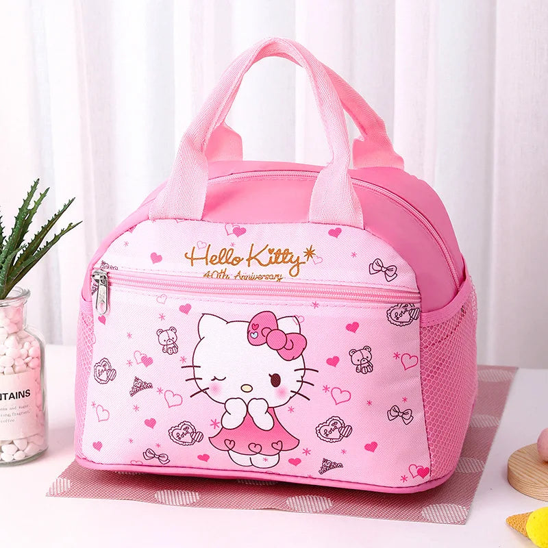 Pink Hello Kitty lunch bag on a white surface with a plant in the background