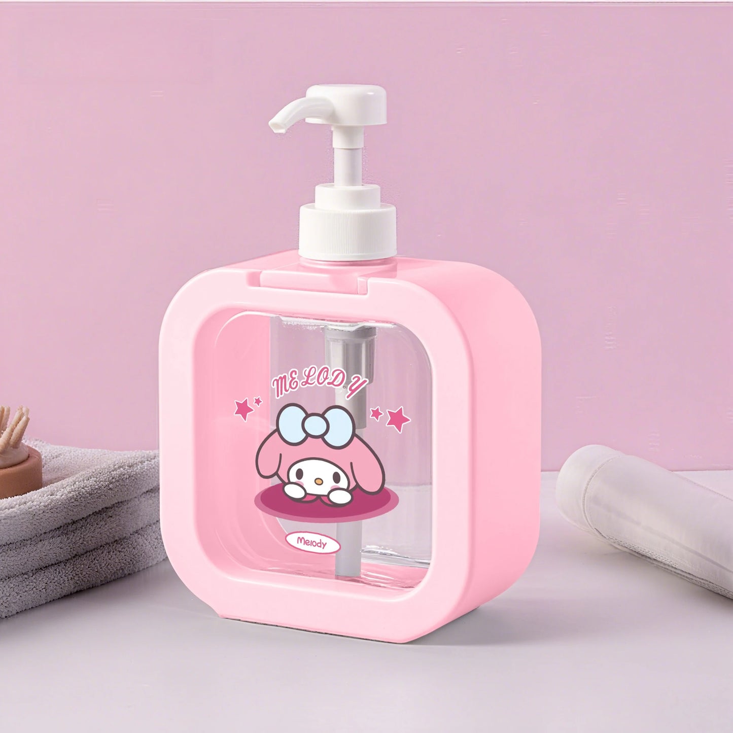 Pink soap dispenser with cartoon character on a pink background