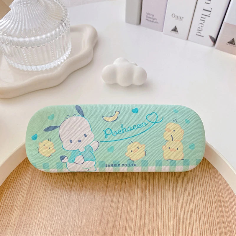 Cute cartoon-themed glasses case on a wooden surface with a light background