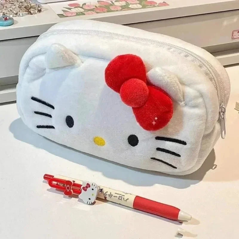 Hello Kitty pencil case with two pens on a light surface