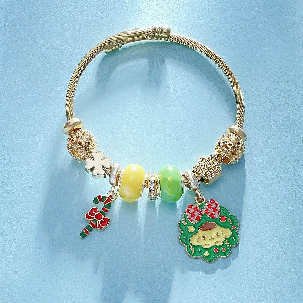 Gold bracelet with colorful beads and charms on a light blue background