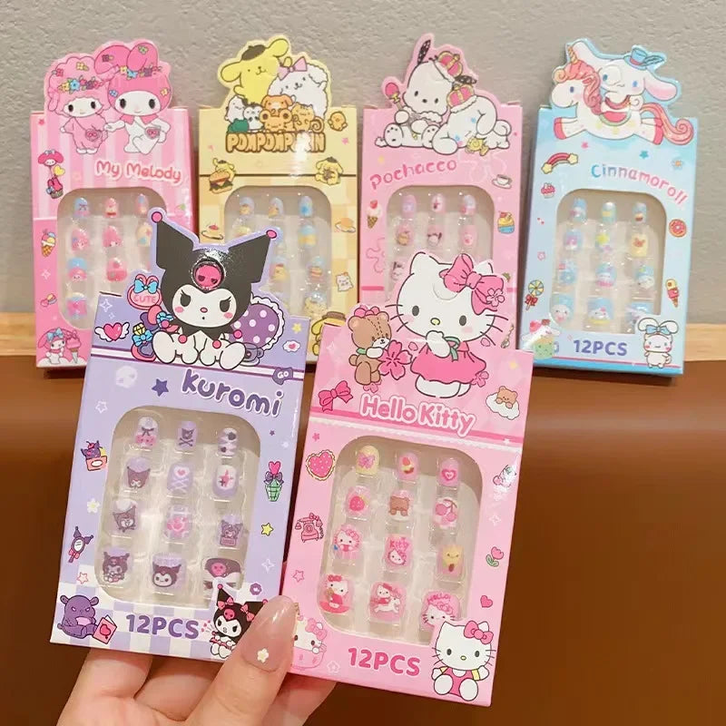 Collection of cartoon character nail art packages on a wooden surface.