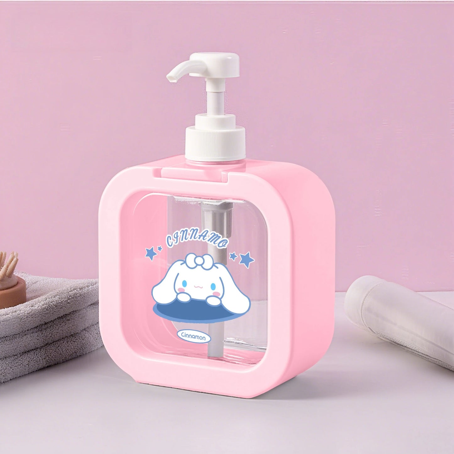 Pink soap dispenser with cartoon character on a pink background