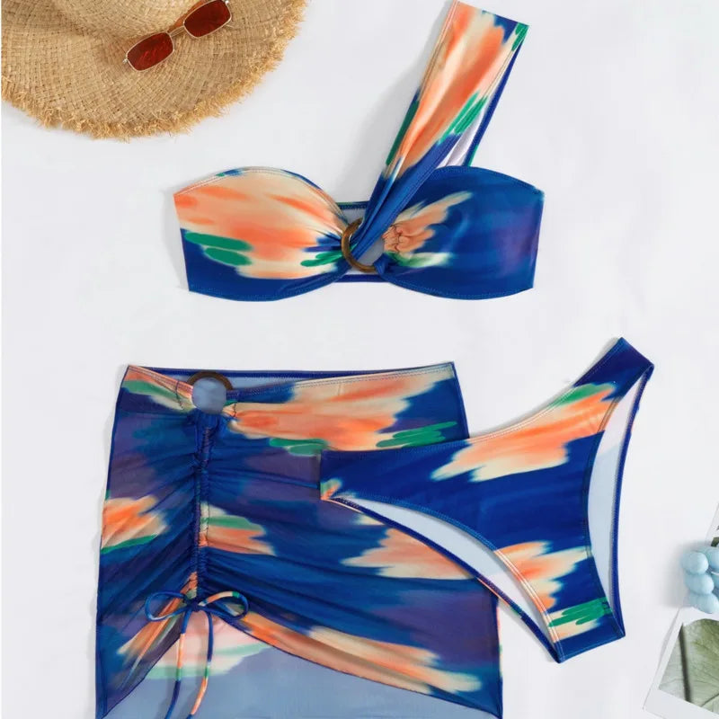 Colorful bikini set with a straw hat on a white background