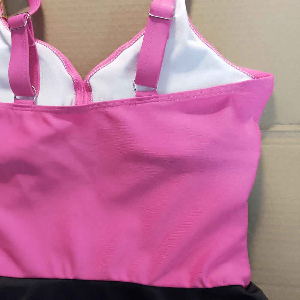 Pink and white bikini top on a cardboard background