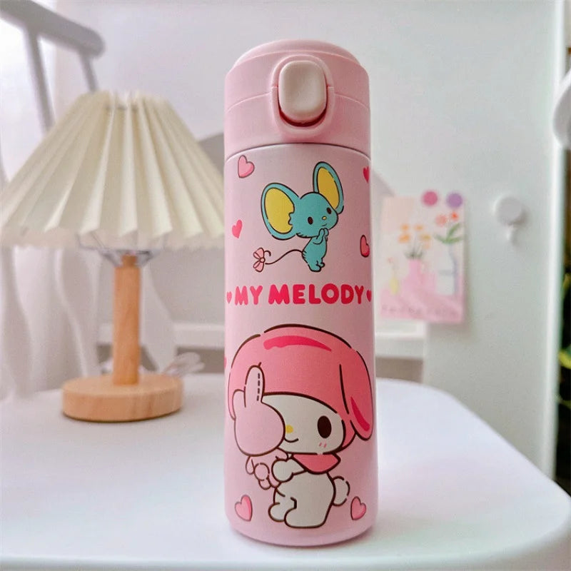 Pink water bottle with cartoon characters on a white surface