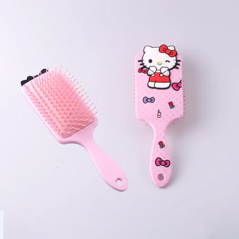 Pink hairbrush with Hello Kitty design on a light gray background