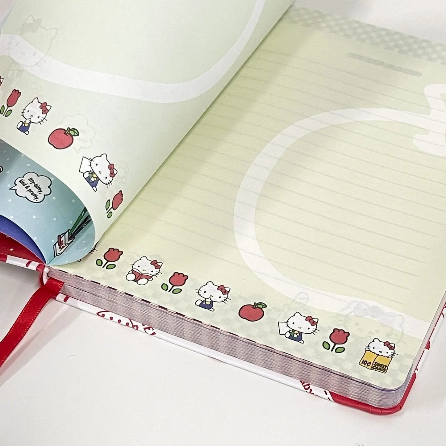 Hello Kitty notebook with red and white design on a white background