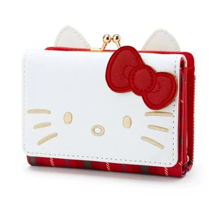 White wallet with red bow and plaid accents on a white background