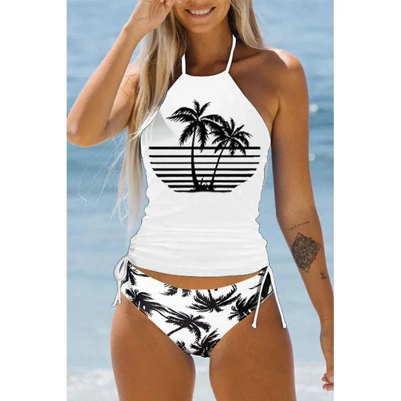 Woman wearing a white bikini with black palm tree design against a beach background