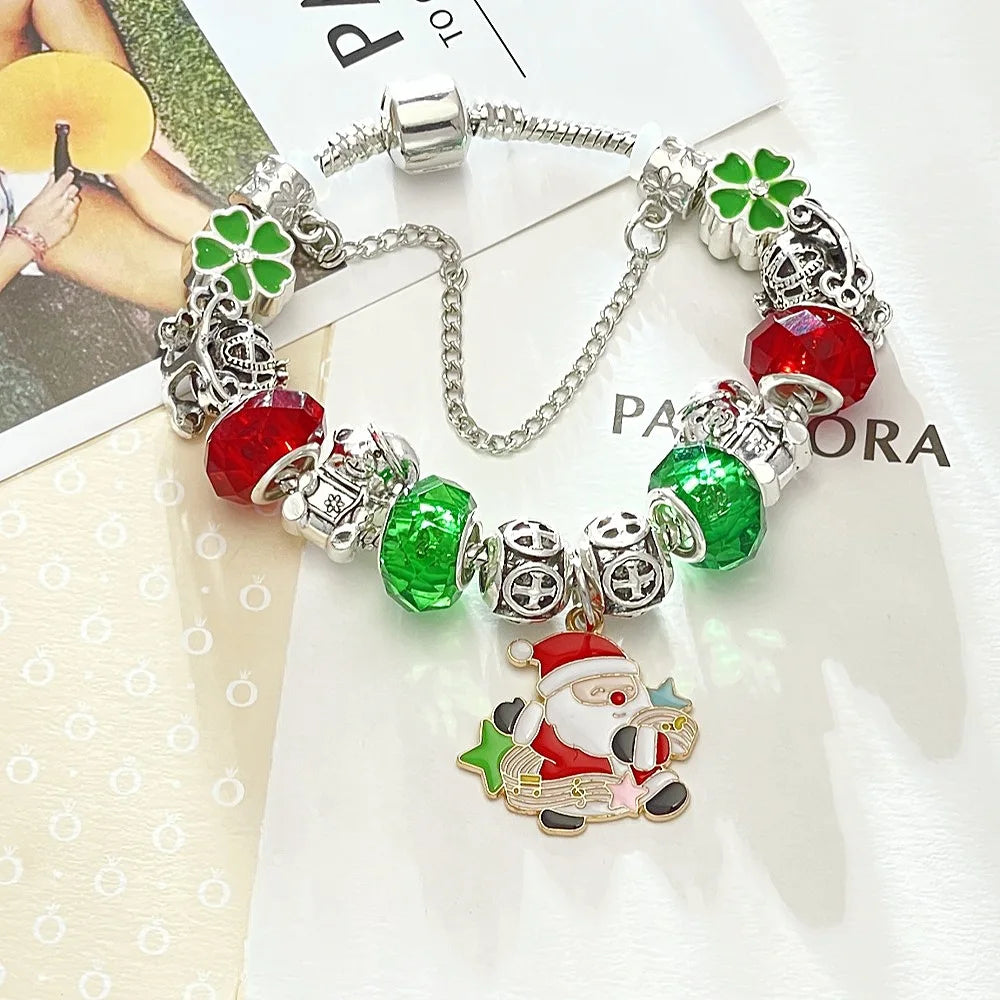 Pandora-style bracelet with Christmas-themed charms on a white background