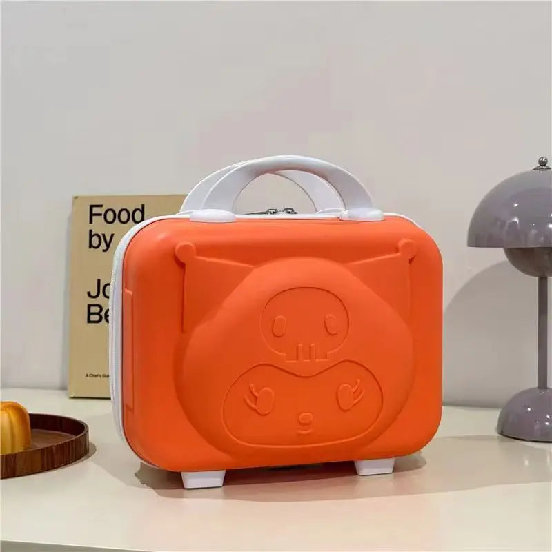 Orange suitcase with a cartoon face design on a white surface.