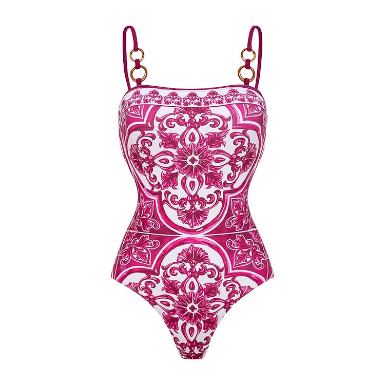 Pink and white patterned swimsuit on a white background