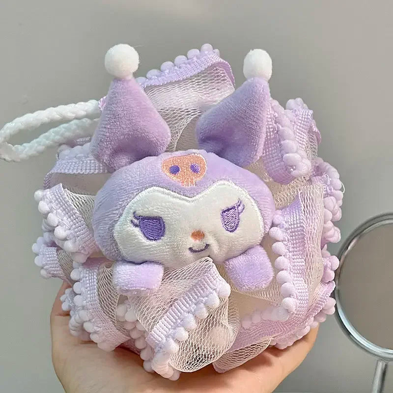 Purple kitty bath scrub plush toy with a mesh bag held by a hand against a neutral background