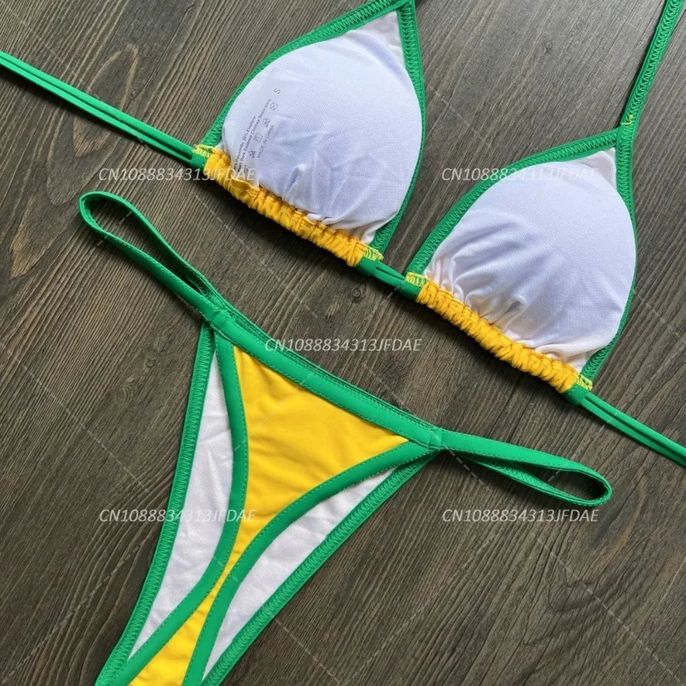 Bikini set with green, yellow, and white colors on a wooden surface