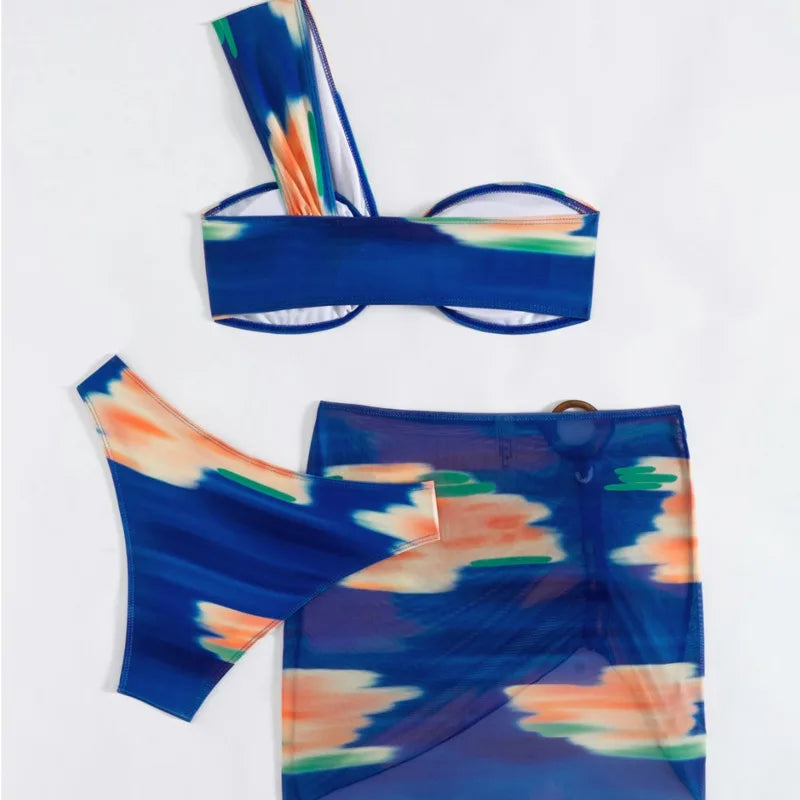 Blue bikini set with abstract multicolor design on a white background