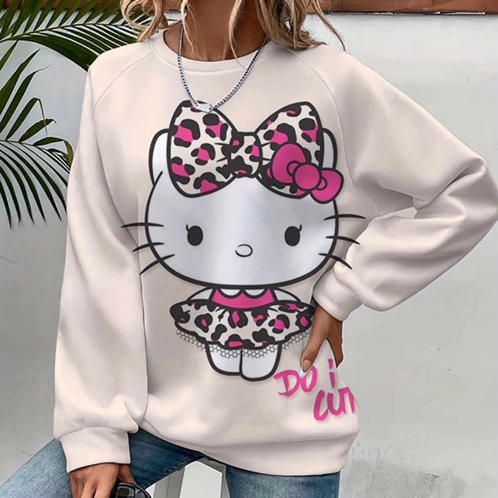 White sweatshirt with a Hello Kitty design featuring a leopard print bow and skirt, worn by a person.