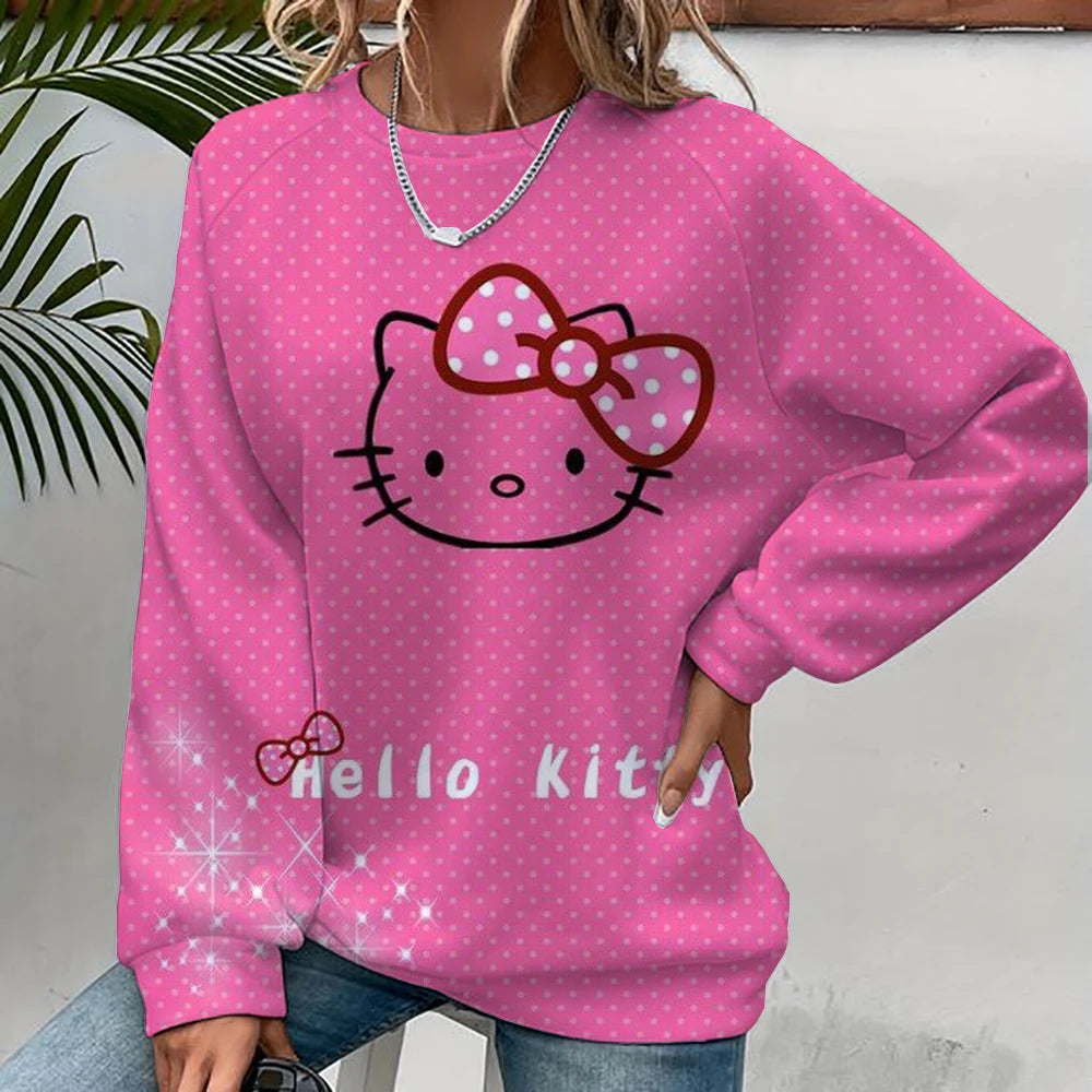 Pink 'Hello Kitty' sweatshirt with a polka dot design worn by a person.