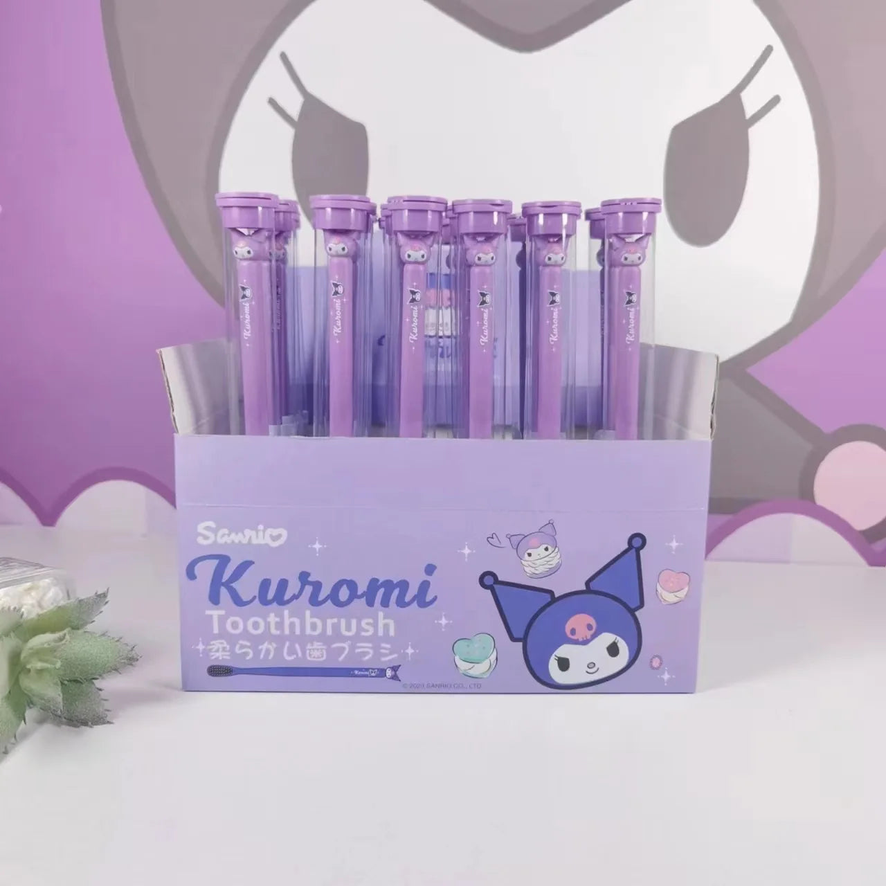 Set of Kuromi toothbrushes in a purple box with a character design on a white background