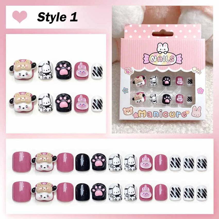 Set of cartoon-themed nail art designs with packaging on a pink background