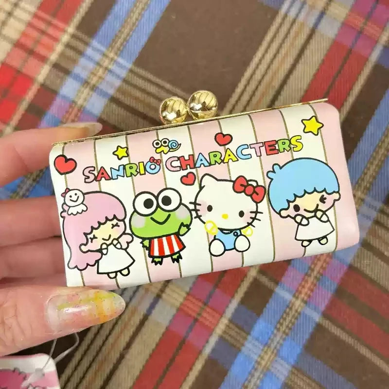 Hand holding a small rectangular pouch with cartoon characters on a plaid background