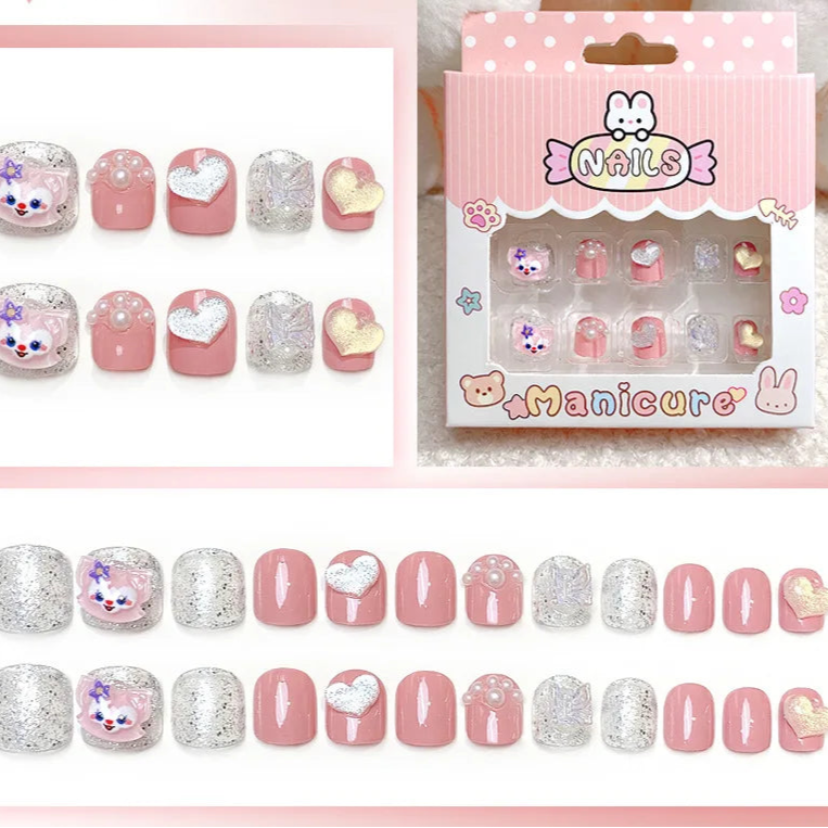 Set of decorative false nails with packaging on a pink background