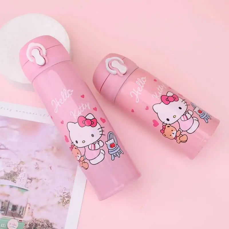 Two pink thermos bottles with Hello Kitty designs on a pink background