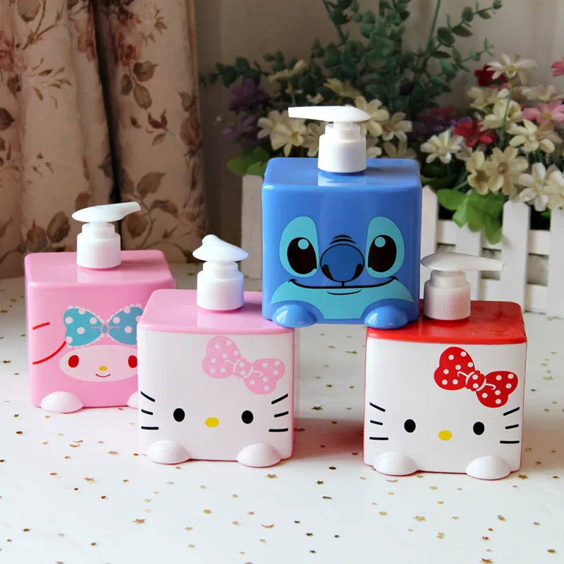 Set of cartoon-themed soap dispensers on a decorative surface with flowers in the background.
