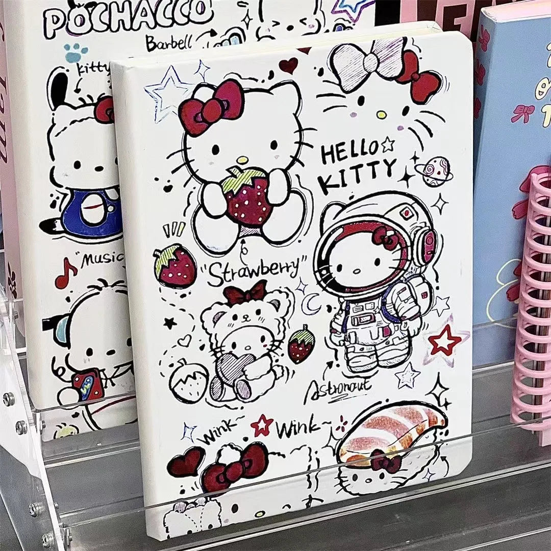 Notebook with Hello Kitty design featuring an astronaut, strawberries, and other elements.