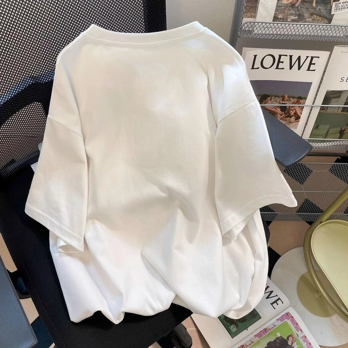 White blouse on a chair with a magazine in the background