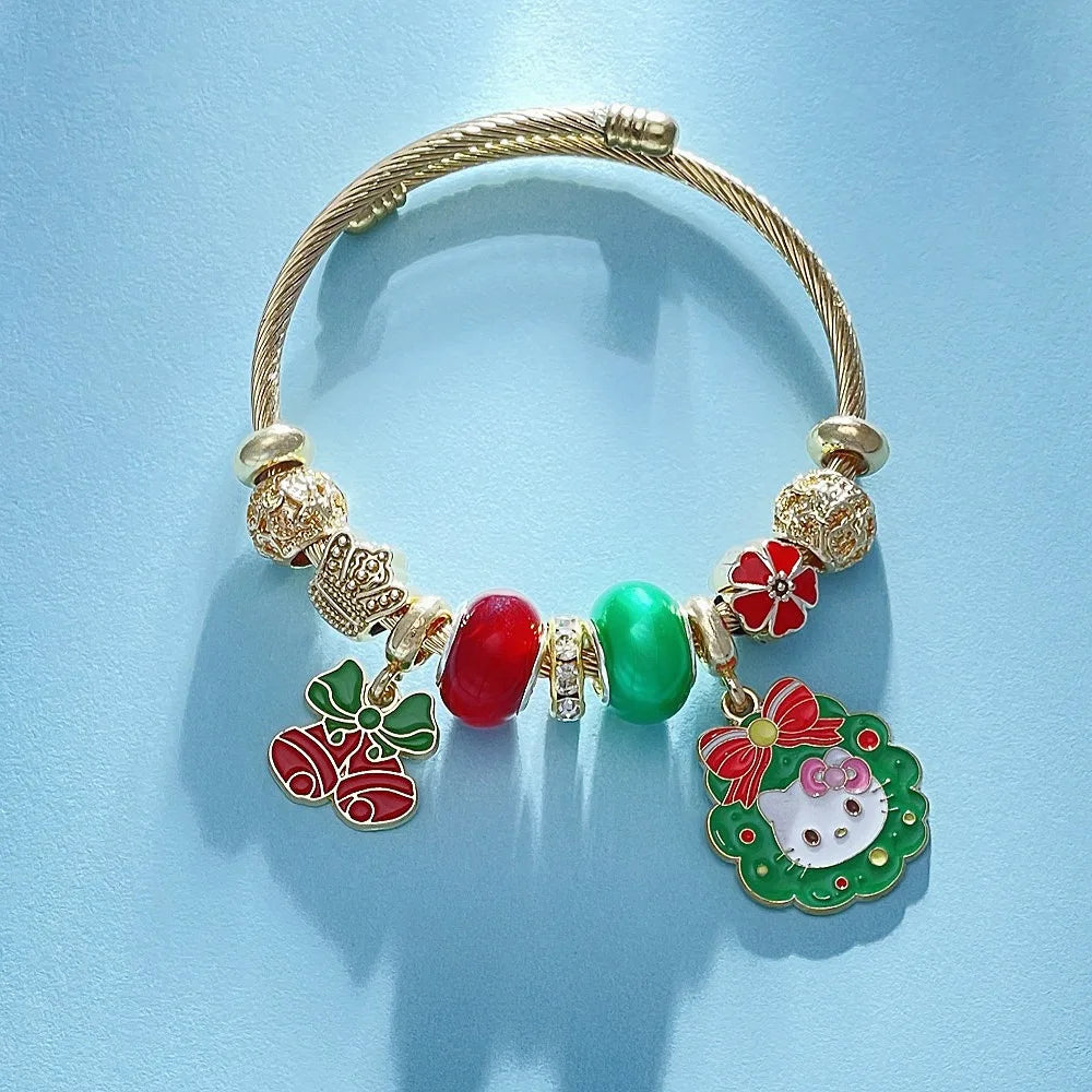 Gold bracelet with colorful charms on a light blue background