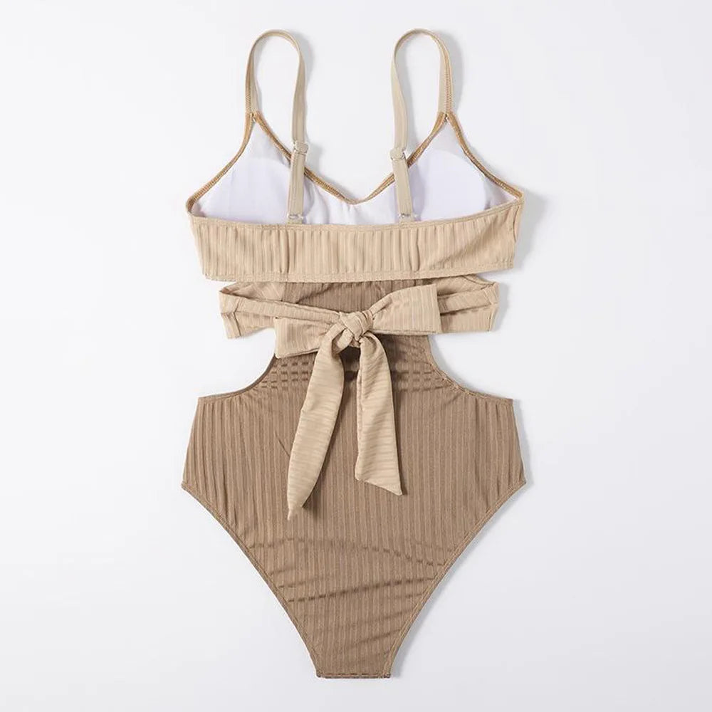Beige ribbed swimsuit with a tie detail on a white background