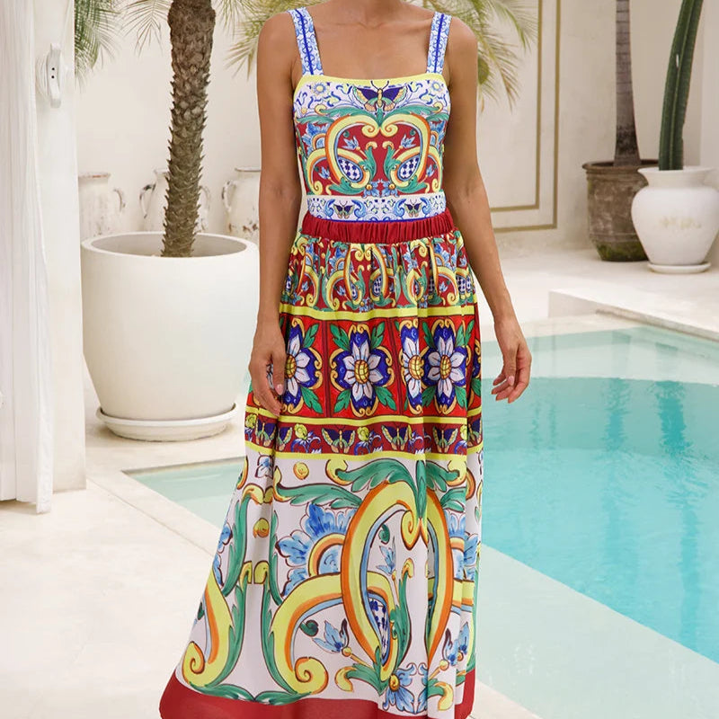 Woman wearing a colorful patterned dress by a pool with palm trees in the background