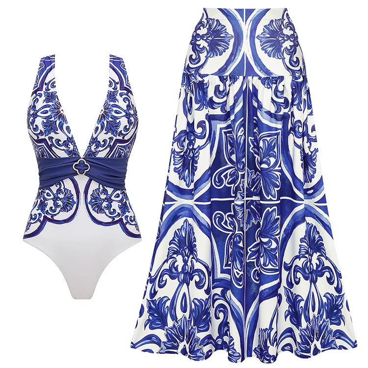Blue and white patterned swimsuit and dress set on a white background
