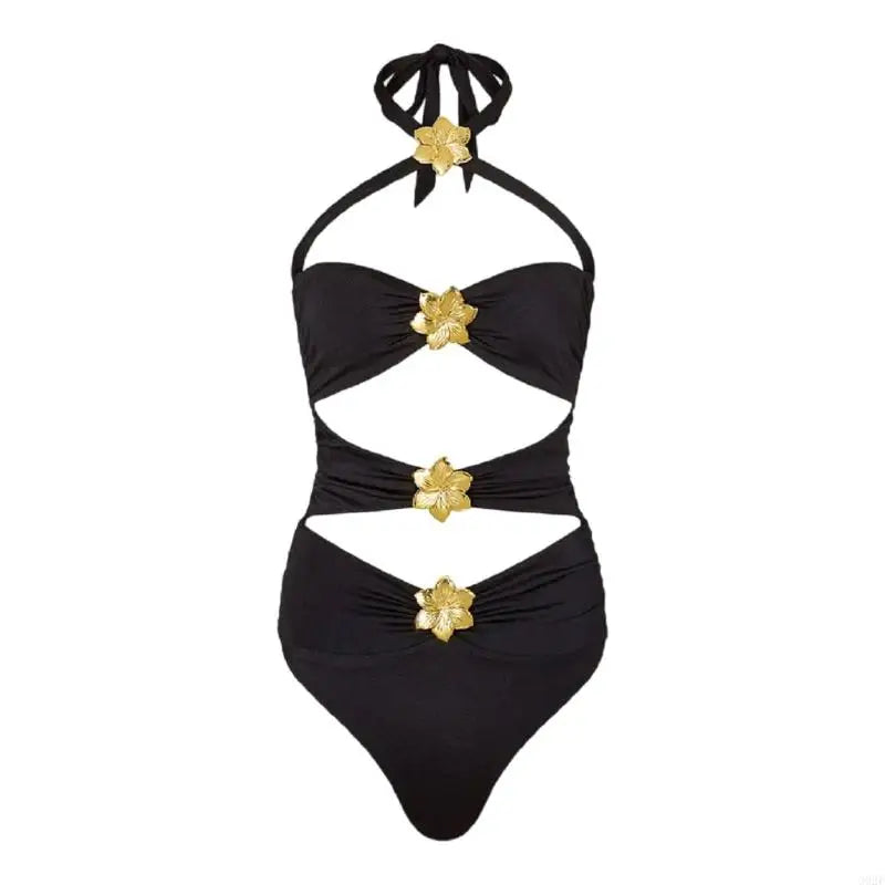 Black swimsuit with gold floral accents on a white background